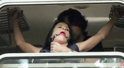 Girl with a gag ball gets fucked in the train
