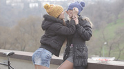 Brunette chick and her blonde BFF both in knitted hats and jacket come in the house to warm up with lesbian games